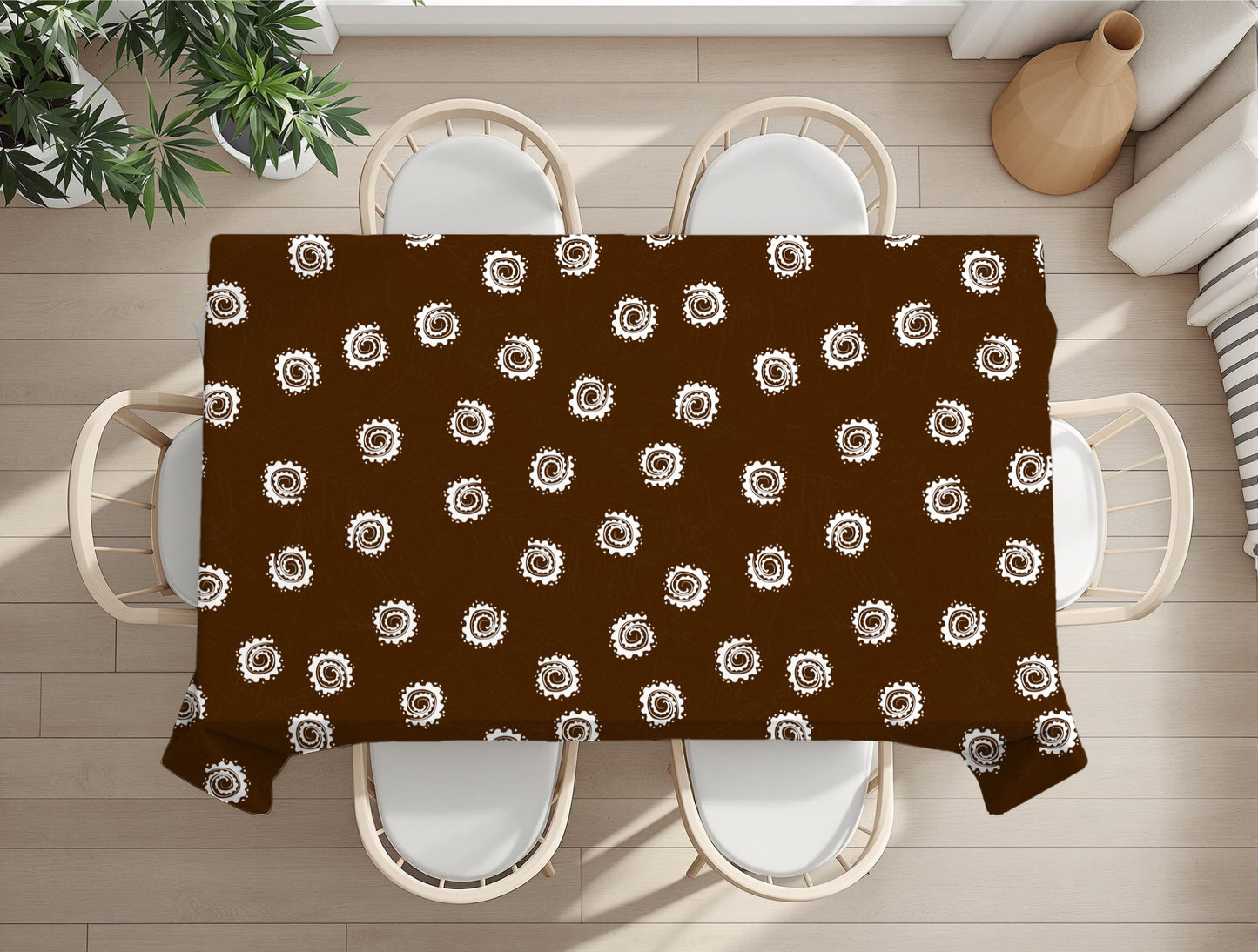 Brown tablecloth with white circular pattern on a wooden table