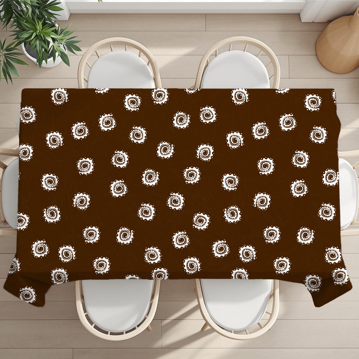 Brown tablecloth with white circular pattern on a wooden table