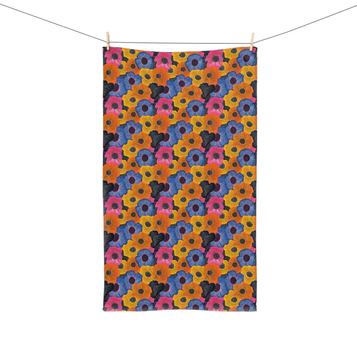 Colorful floral patterned towel hanging on a line.