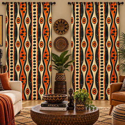 A pair of long curtains hanging in a styled living room. The curtains feature a bold, vertical tribal-style pattern with wavy orange and black shapes on a cream background, decorated with circular and oval motifs.