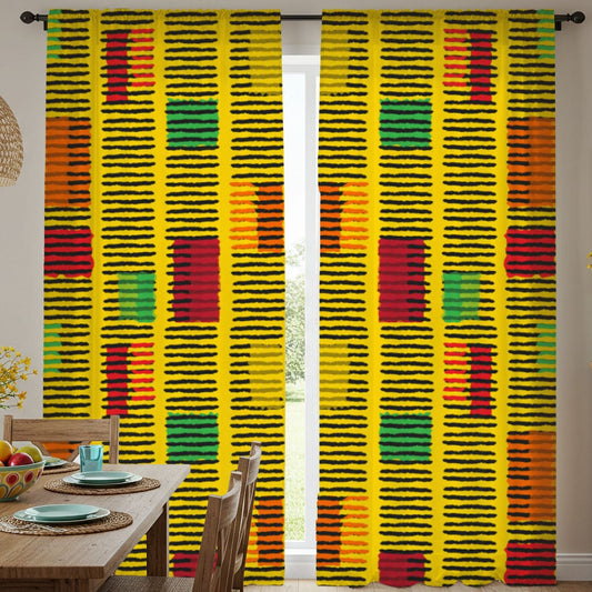 Dining room with colorful patterned curtains and a wooden table.