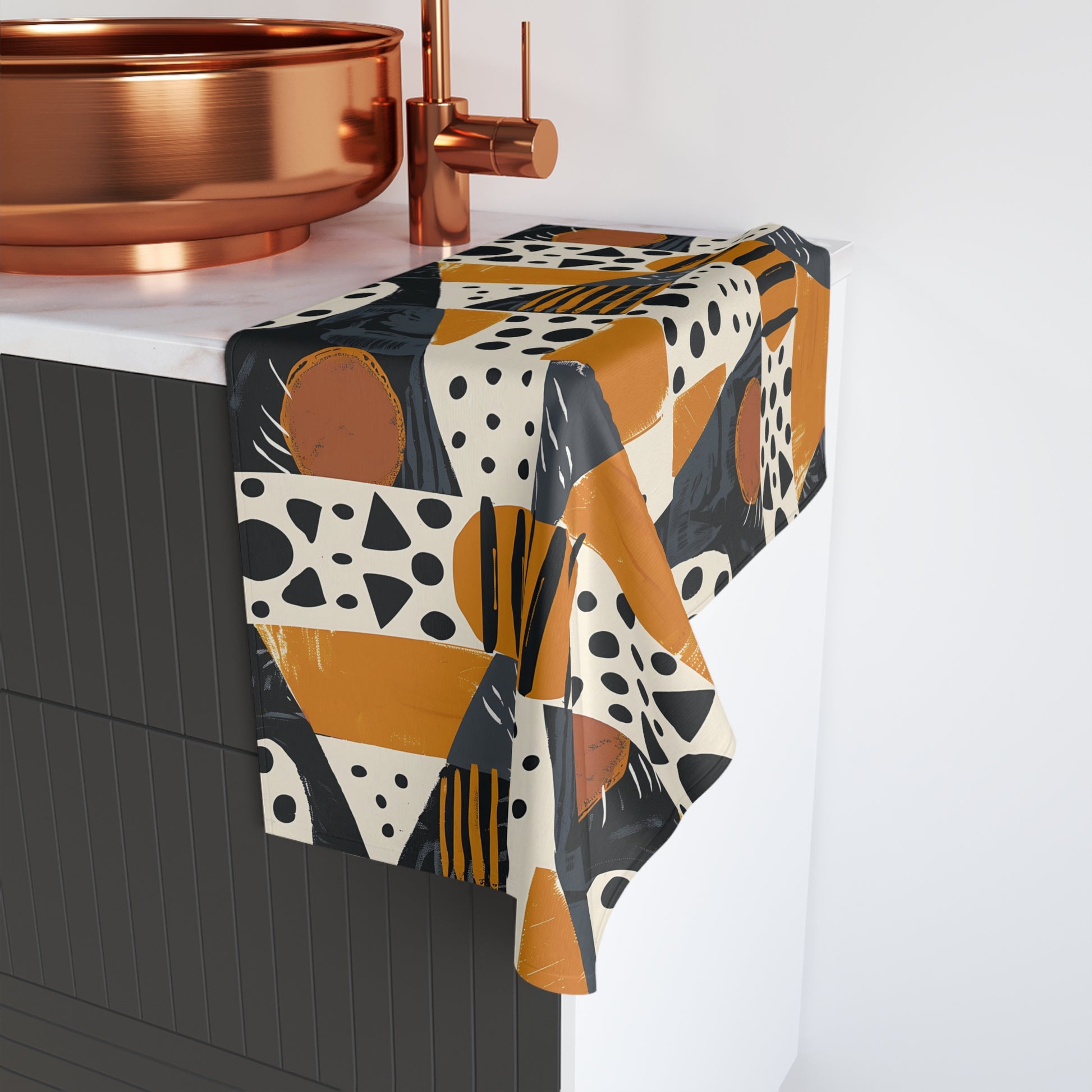 Geometric Patterned Tablecloth on a table with a copper faucet in the background