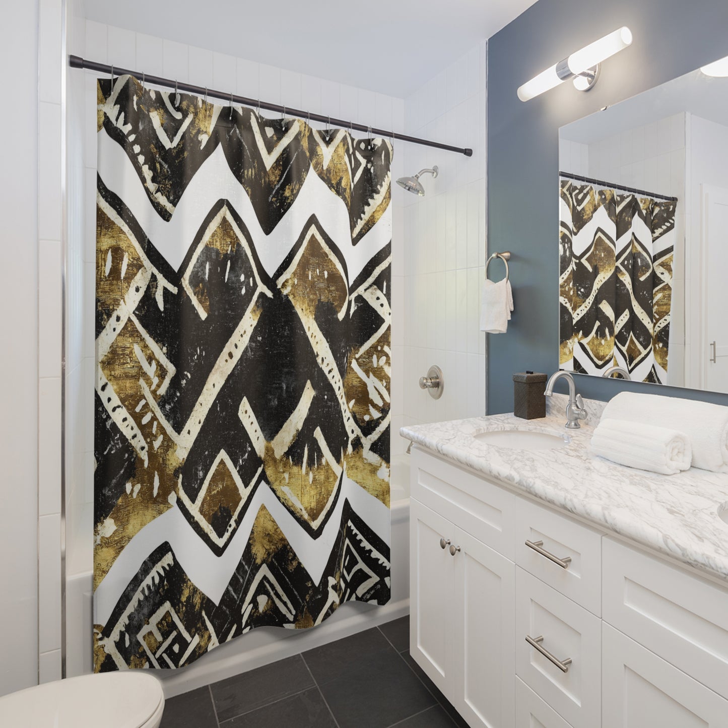 Bathroom with a shower curtain featuring a black, gold, and white pattern.