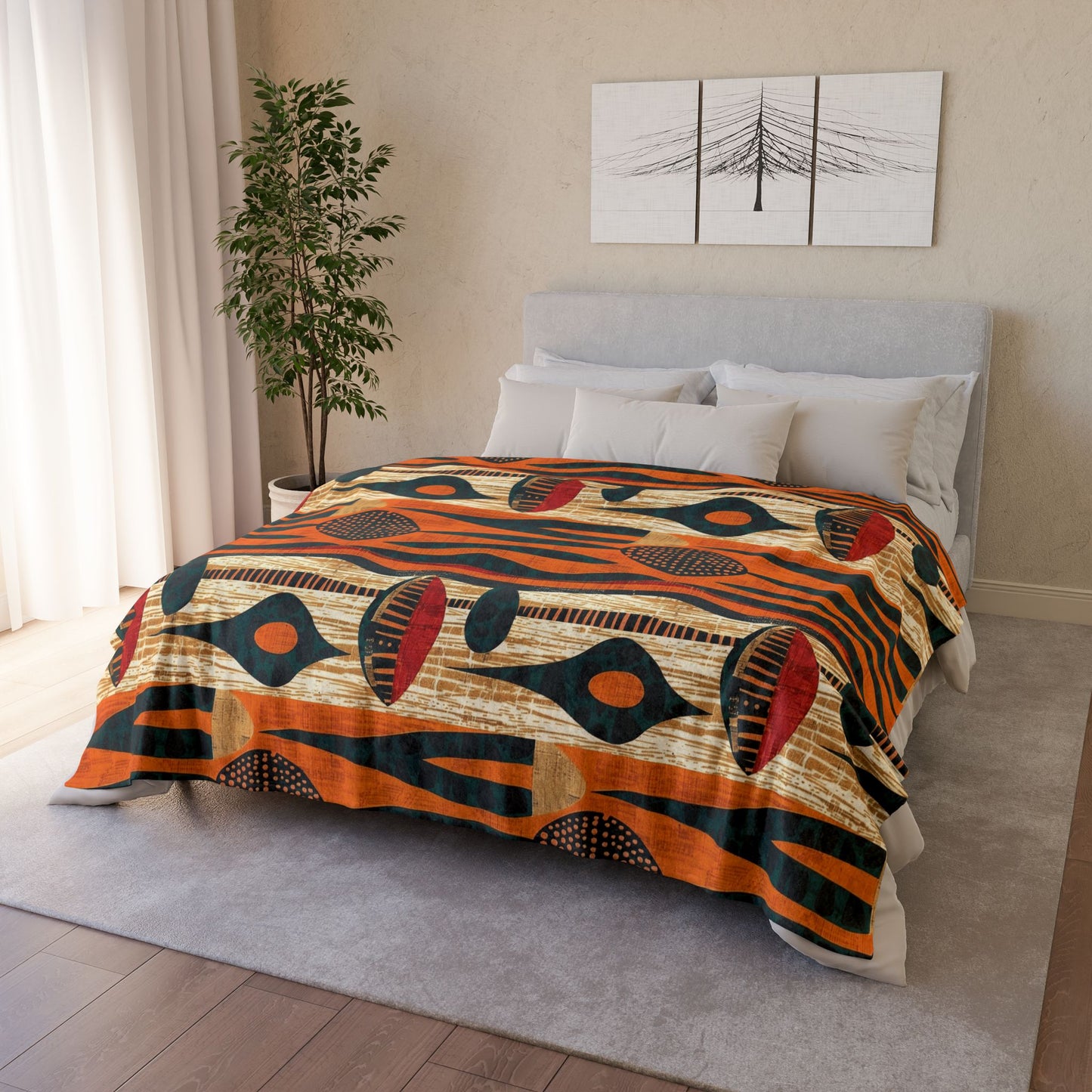 Bedroom with a colorful african patterned blanket on a bed, light-colored walls, and a plant.