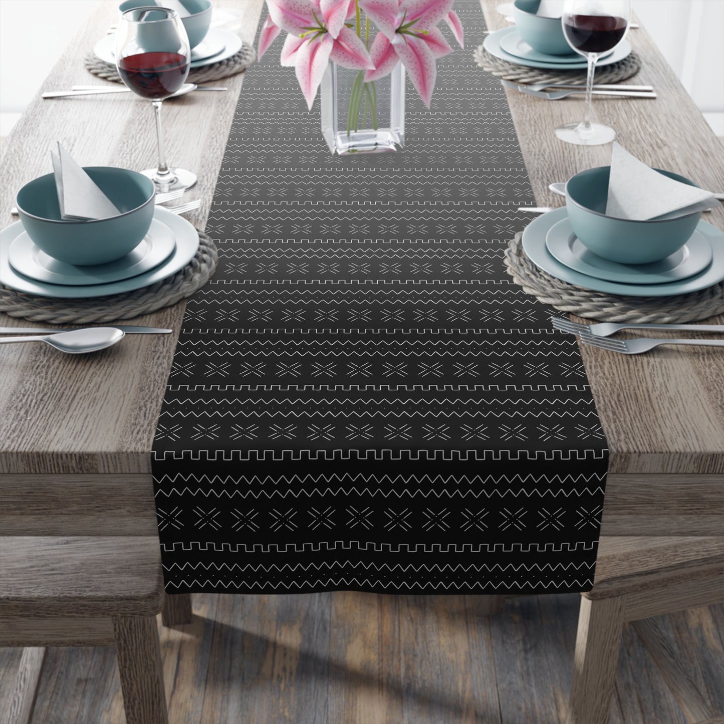 Cultural dining linens including African print napkins, placemats, and table runners.
