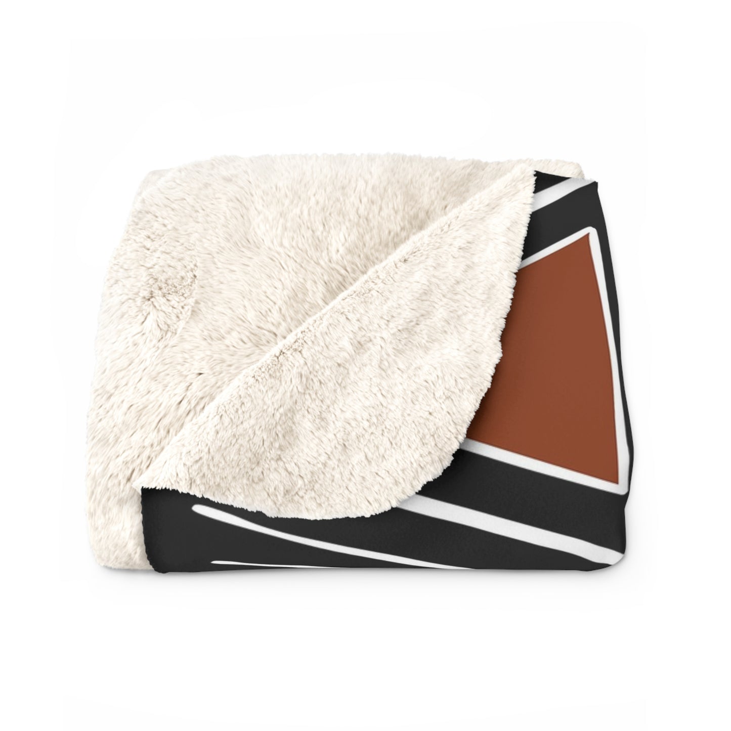 Folded blanket with white sherpa side and geometric pattern on a white background