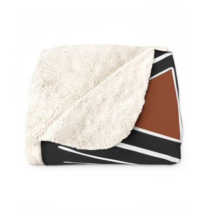 African Print Blanket with white sherpa side and geometric pattern on a white background