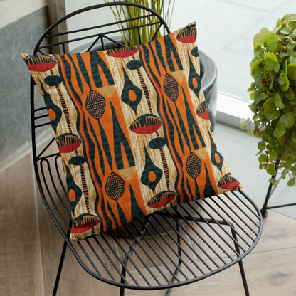 Decorative pillow with a geometric pattern on a black metal chair indoors.