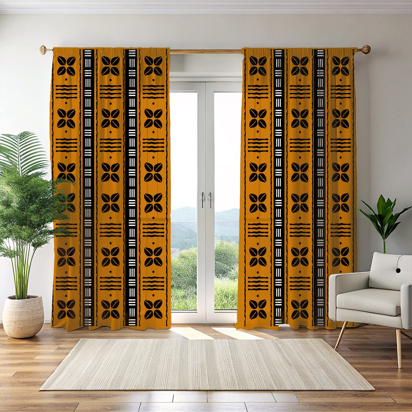 A pair of yellow blackout curtains with black tribal patterns, displayed in a room setting with a chair, cushions, and a plant.