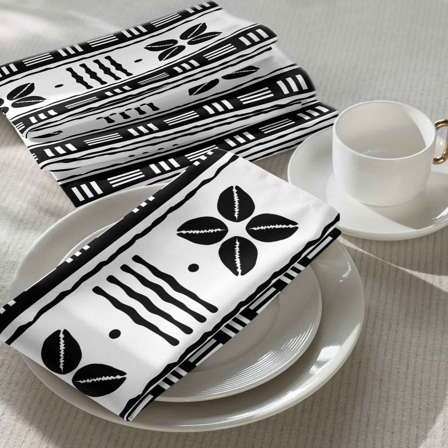 Cultural dining linens including African print napkins, placemats, and table runners.