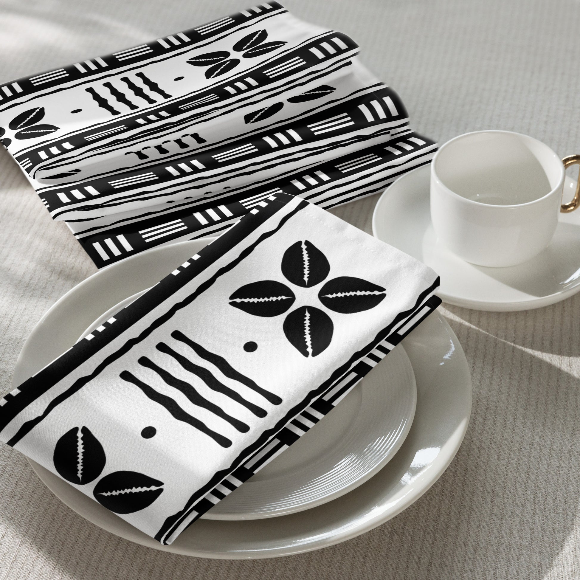 Cultural dining linens including African print napkins, placemats, and table runners.