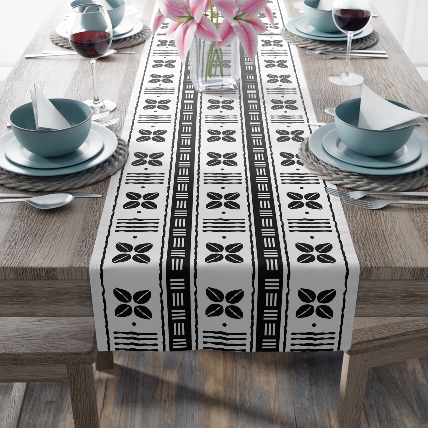 Cultural dining linens including African print napkins, placemats, and table runners.