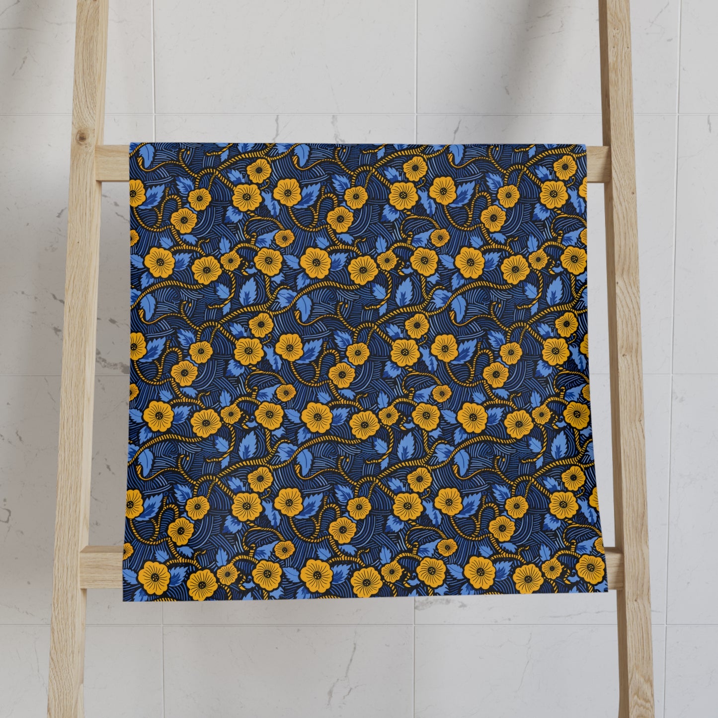 Floral African Print towels on a wooden ladder against a white wall