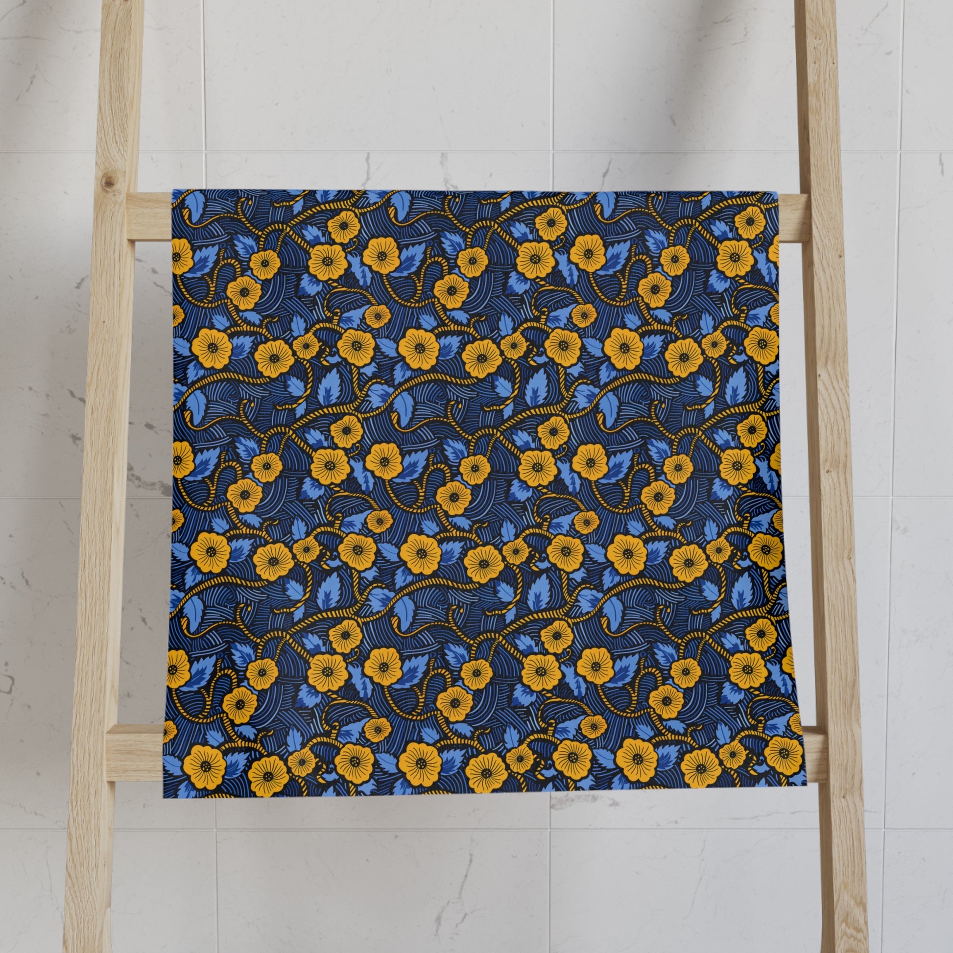 Floral African Print towels on a wooden ladder against a white wall
