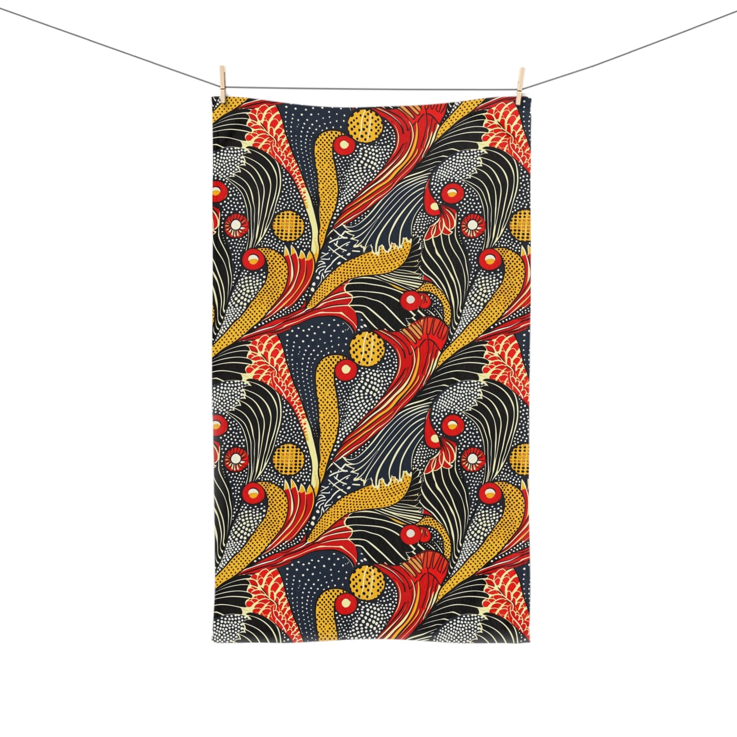Decorative towel with a colorful abstract pattern hanging on a line.