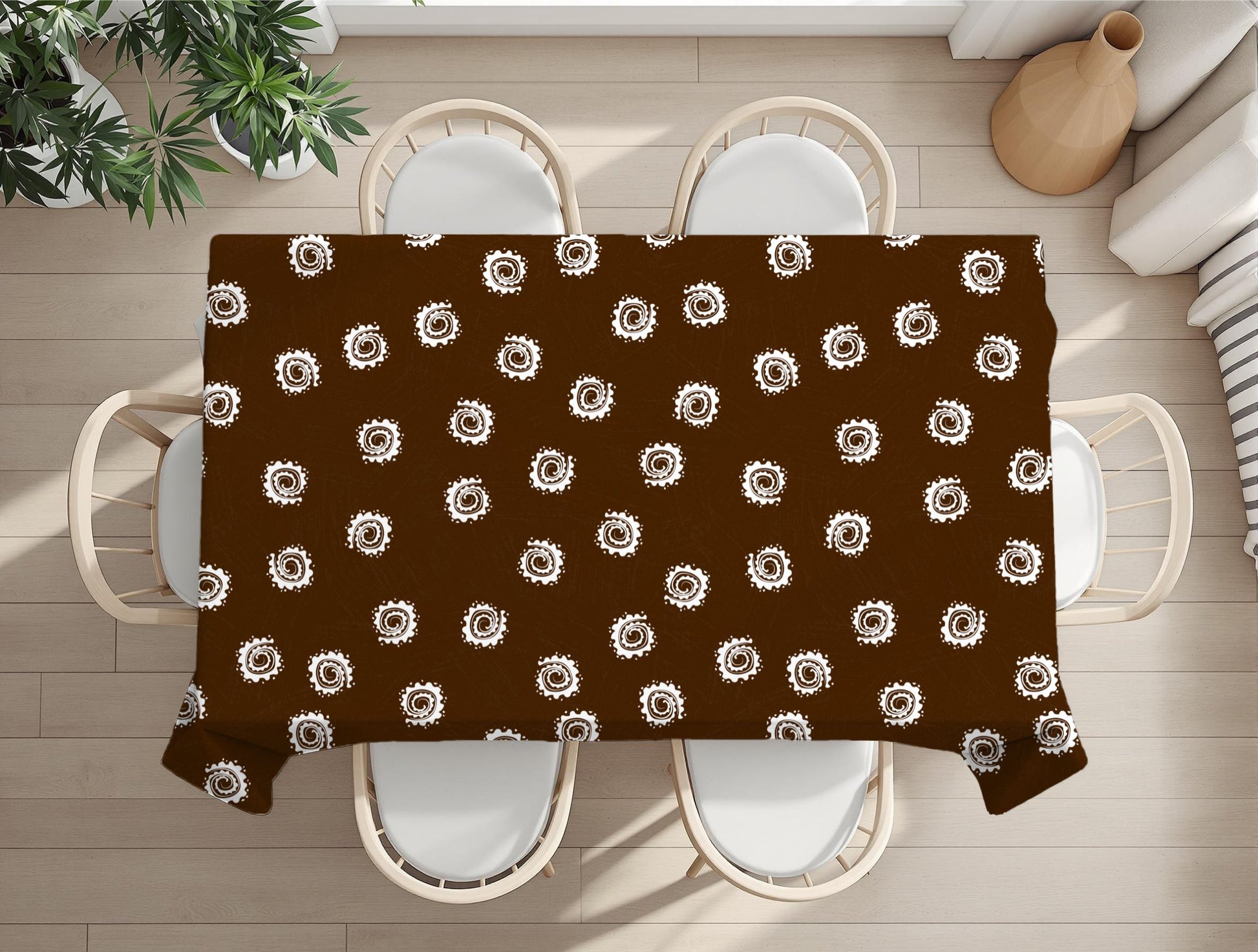 Brown tablecloth with white circular pattern on a wooden table