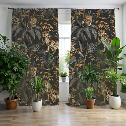 A pair of window curtains featuring a black and gold floral pattern with cheetah motifs, hanging in a room with a chair, a wicker sofa, and a large window.
