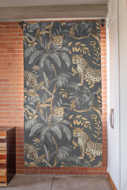 A pair of window curtains featuring a black and gold floral pattern with cheetah motifs, hanging in a room with a chair, a wicker sofa, and a large window.