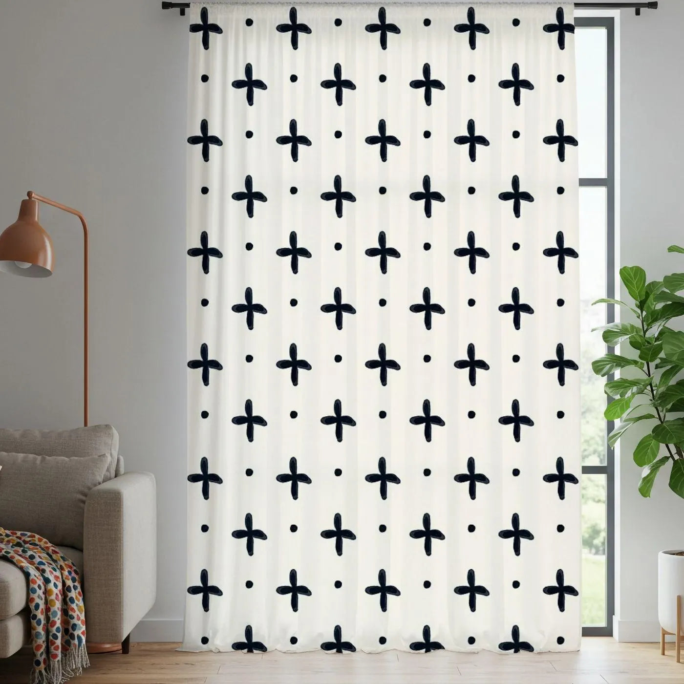 Curtain with black geometric pattern in a living room setting