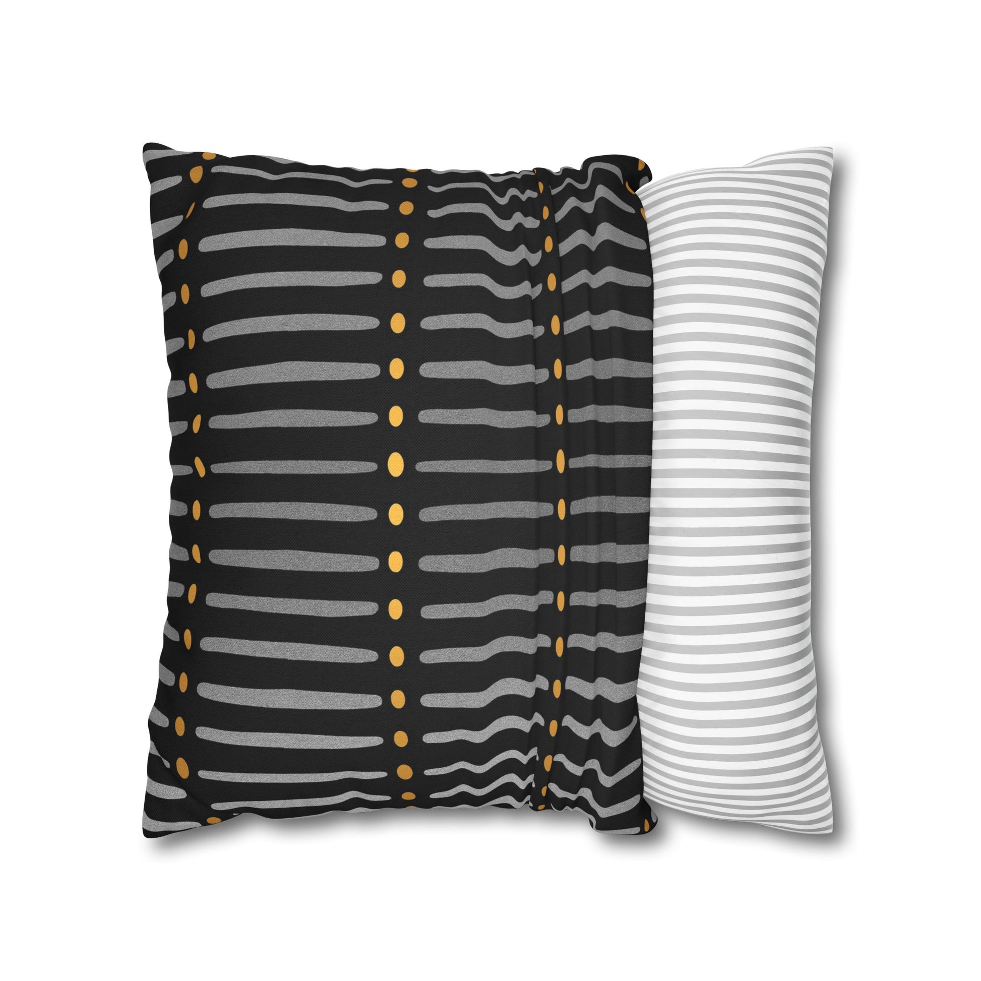 Two striped pillows, one with black, gray, and gold pattern and the other with white and gray stripes, on a white background.