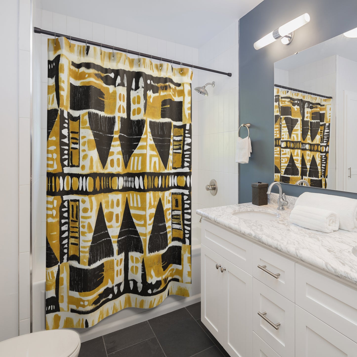 Bathroom with a yellow and black patterned shower curtain, white vanity, and mirror.