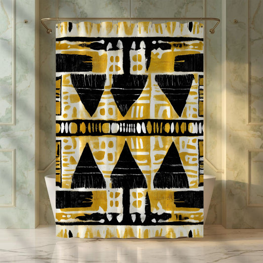 Mudcloth shower curtain with geometric pattern in yellow, black, and white on a marble bathroom background