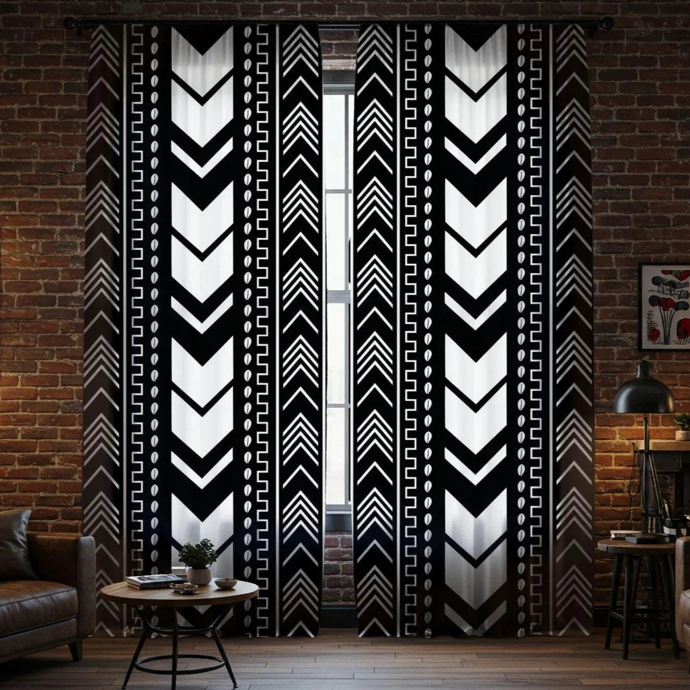 Black and white patterned curtains in a room with a brick wall.