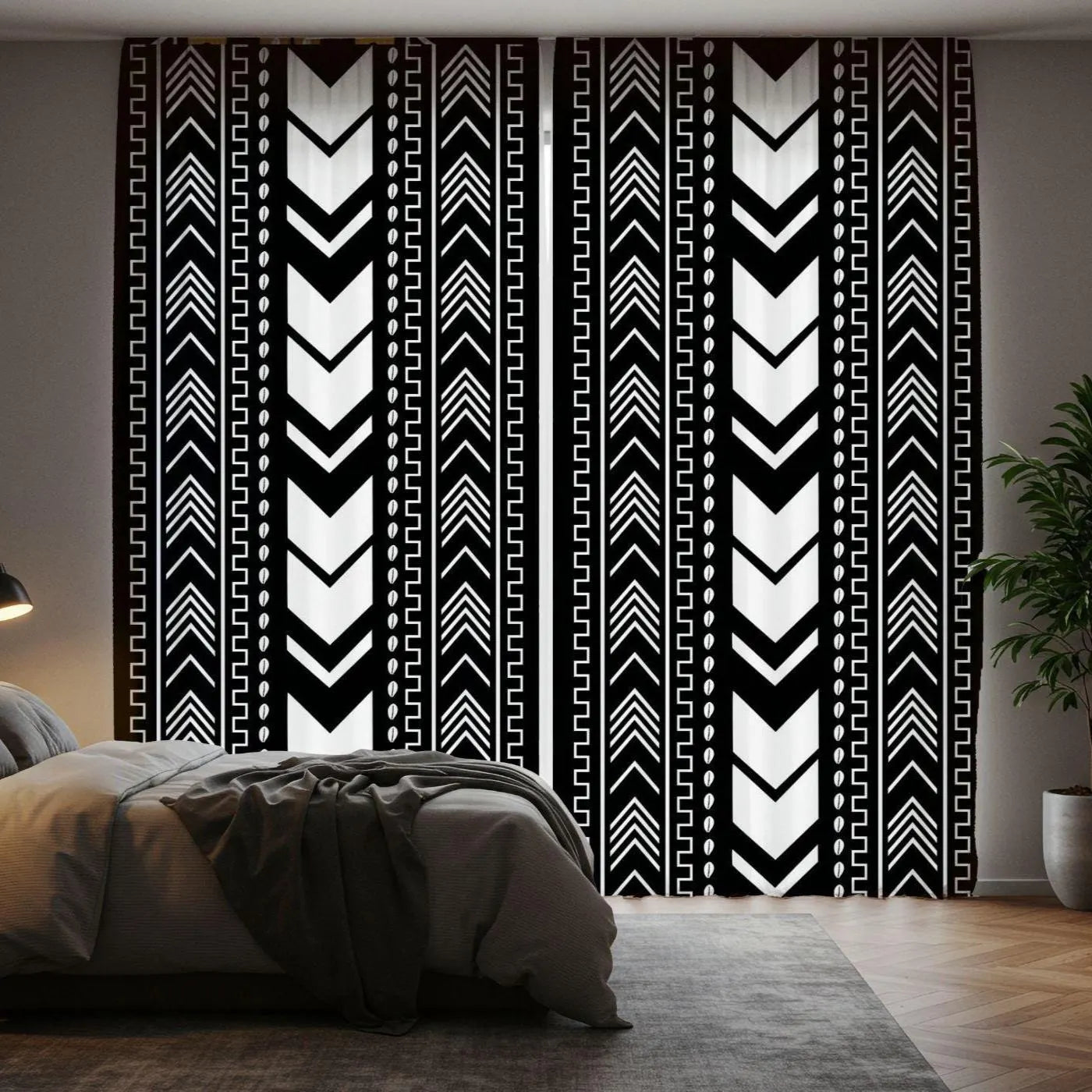 Bedroom with a decorative wall tapestry featuring black and white patterns.