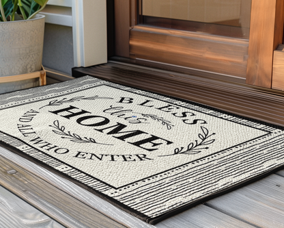 Decorative doormat with text on a wooden floor next to a door.
