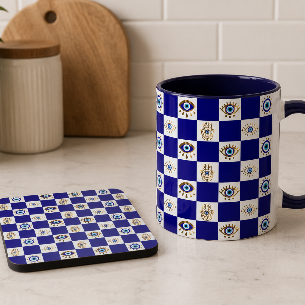 Blue and white checkered mug and coaster on a kitchen counter with a plant and cutting board in the background.