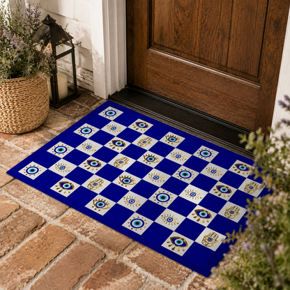 Decorative doormat with a blue and white checkered pattern on a brick floor.