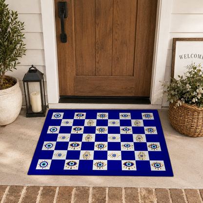 Decorative checkered mat with evil eye pattern on a porch floor.