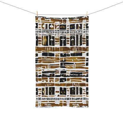 Mudcloth towel with a geometric pattern hanging on a line against a white background