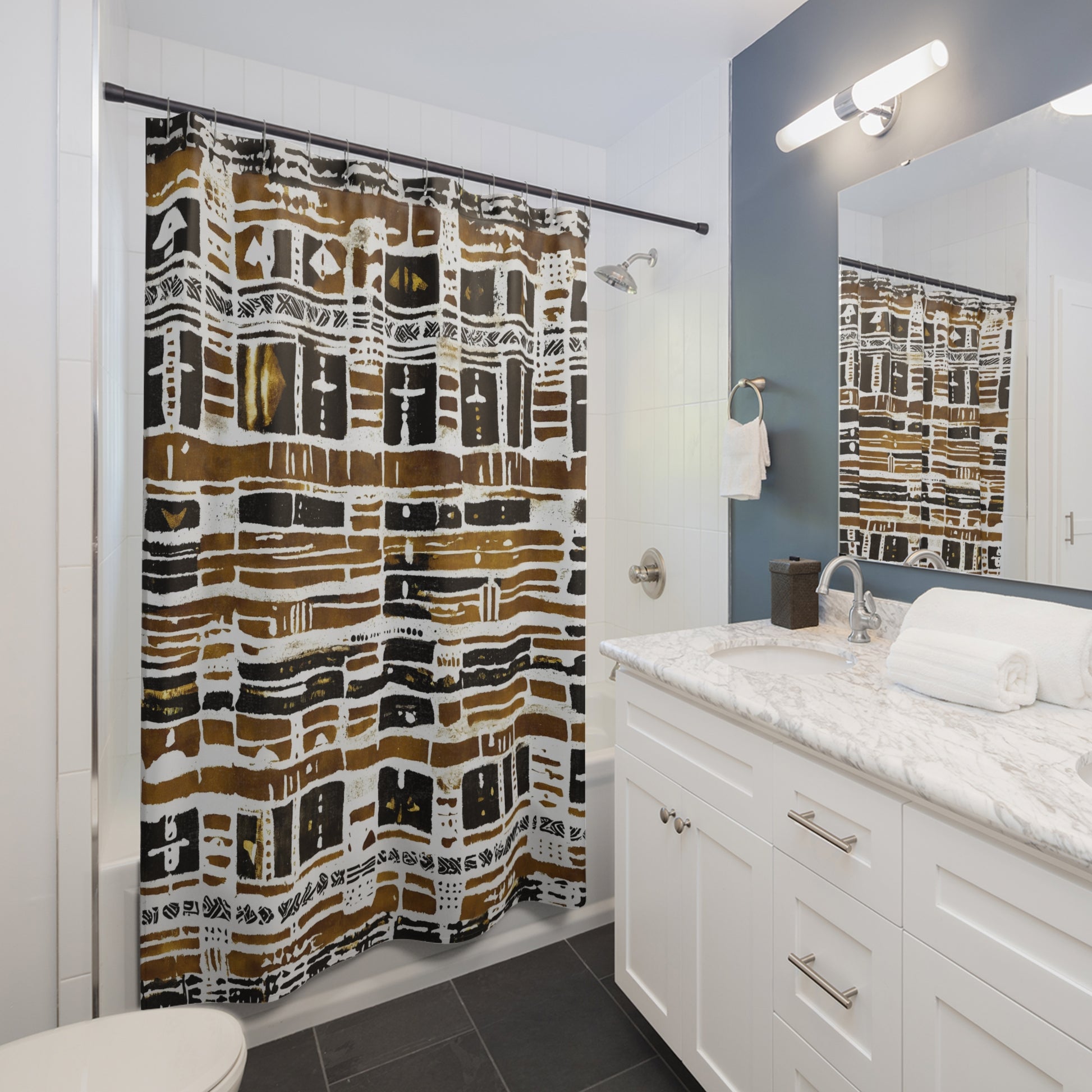 Bathroom with a patterned shower curtain, white vanity, and mirror.