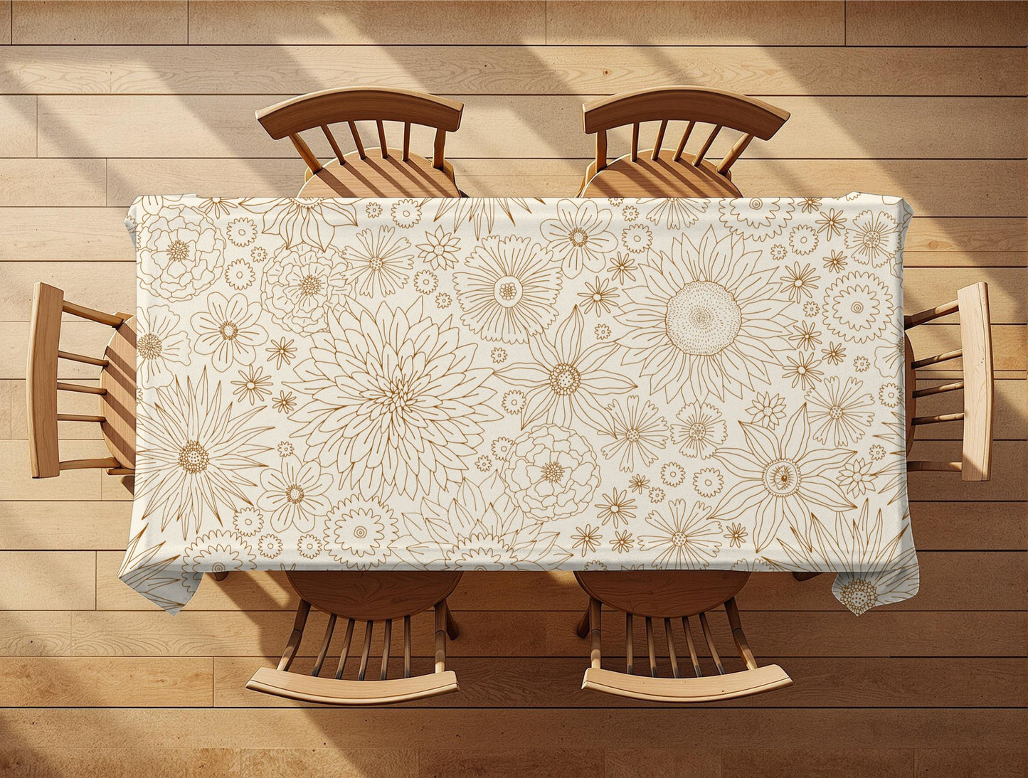 Table with a floral patterned tablecloth on a wooden floor