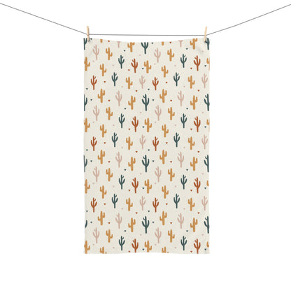 Decorative towel with cactus pattern hanging on a line