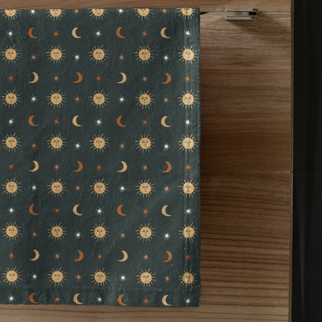 Patterned fabric with celestial design on a wooden surface