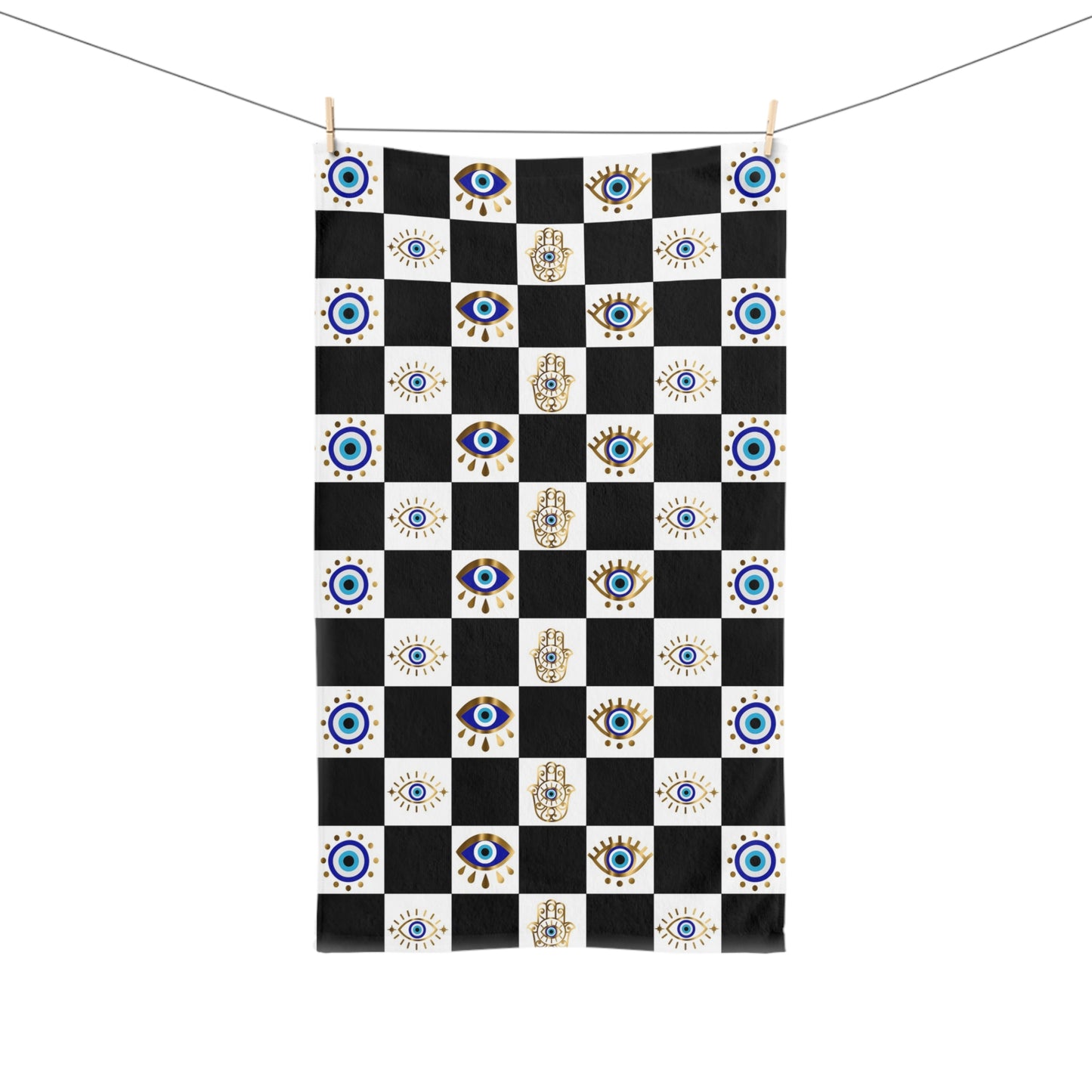 Checkered towel with eye and hand designs on a white background