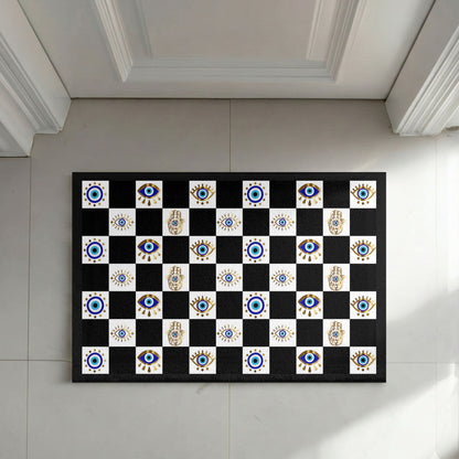 Decorative checkered rug with eye and hand patterns on a tiled floor.