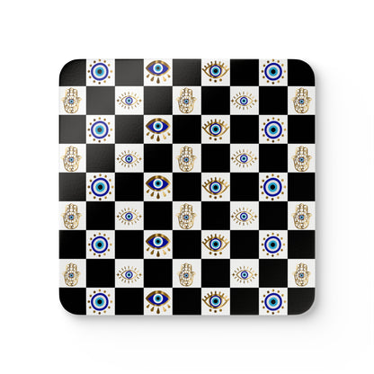 Checkered mouse pad with Hamsa hand and eye designs on a black and white background