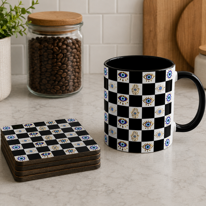 Black and white checkered mug and coasters on a kitchen counter with coffee beans and a plant in the background.