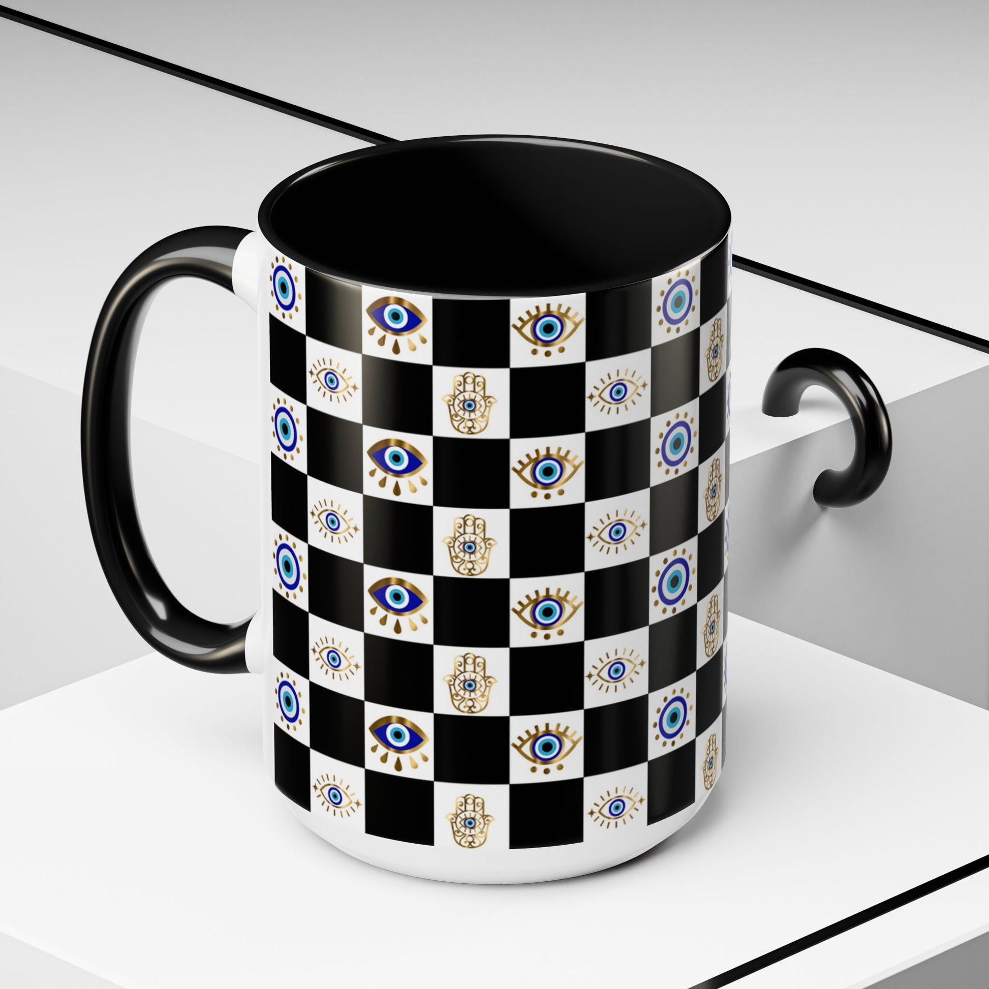 Black mug with a checkered pattern featuring evil eye and hamsa hands on a white background
