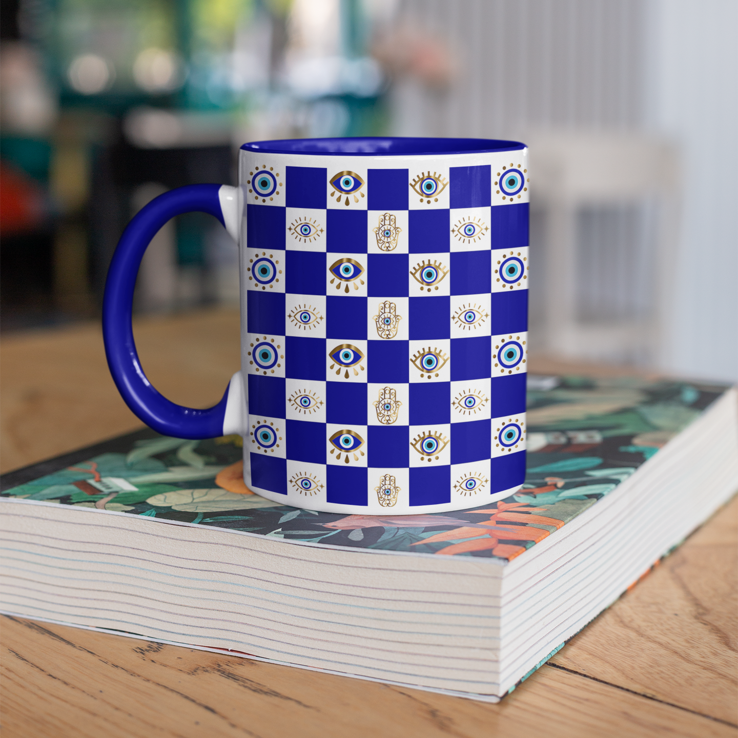 Mug with blue and white checkered pattern on a stack of books