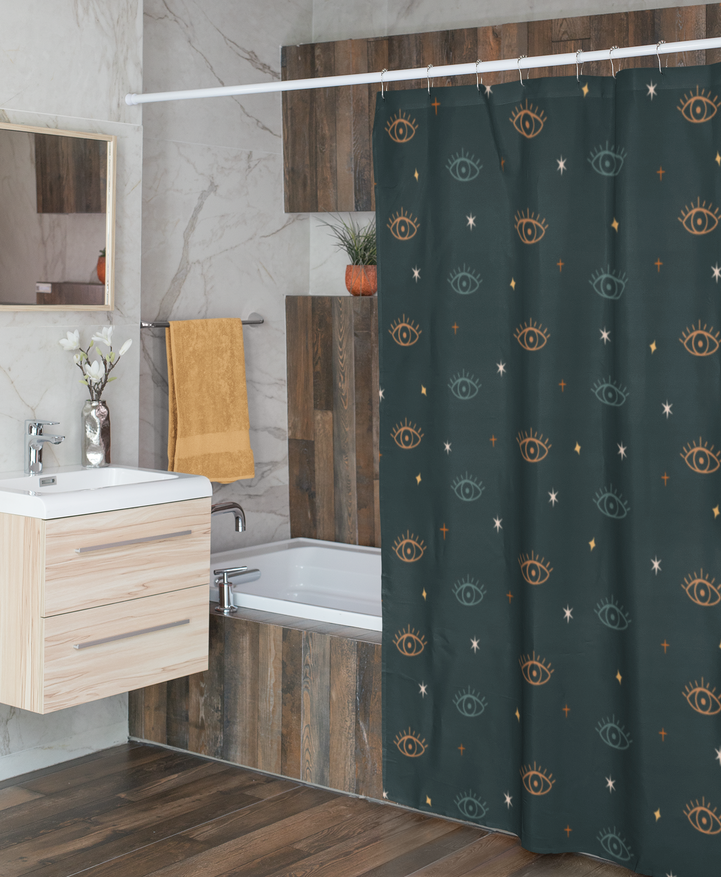 Bathroom with a shower curtain featuring evil eye boho patterns, a sink, and a bathtub.