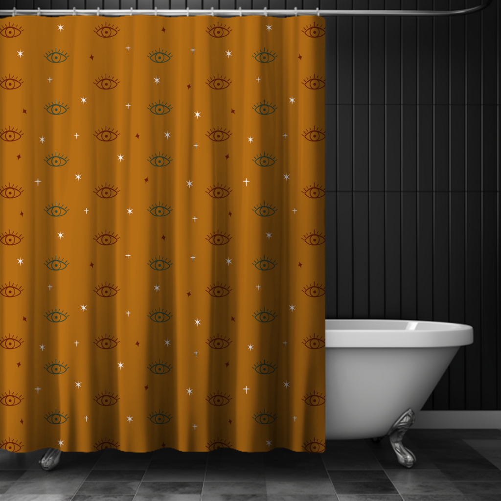 Mustard yellow shower curtain with eye pattern in a bathroom setting