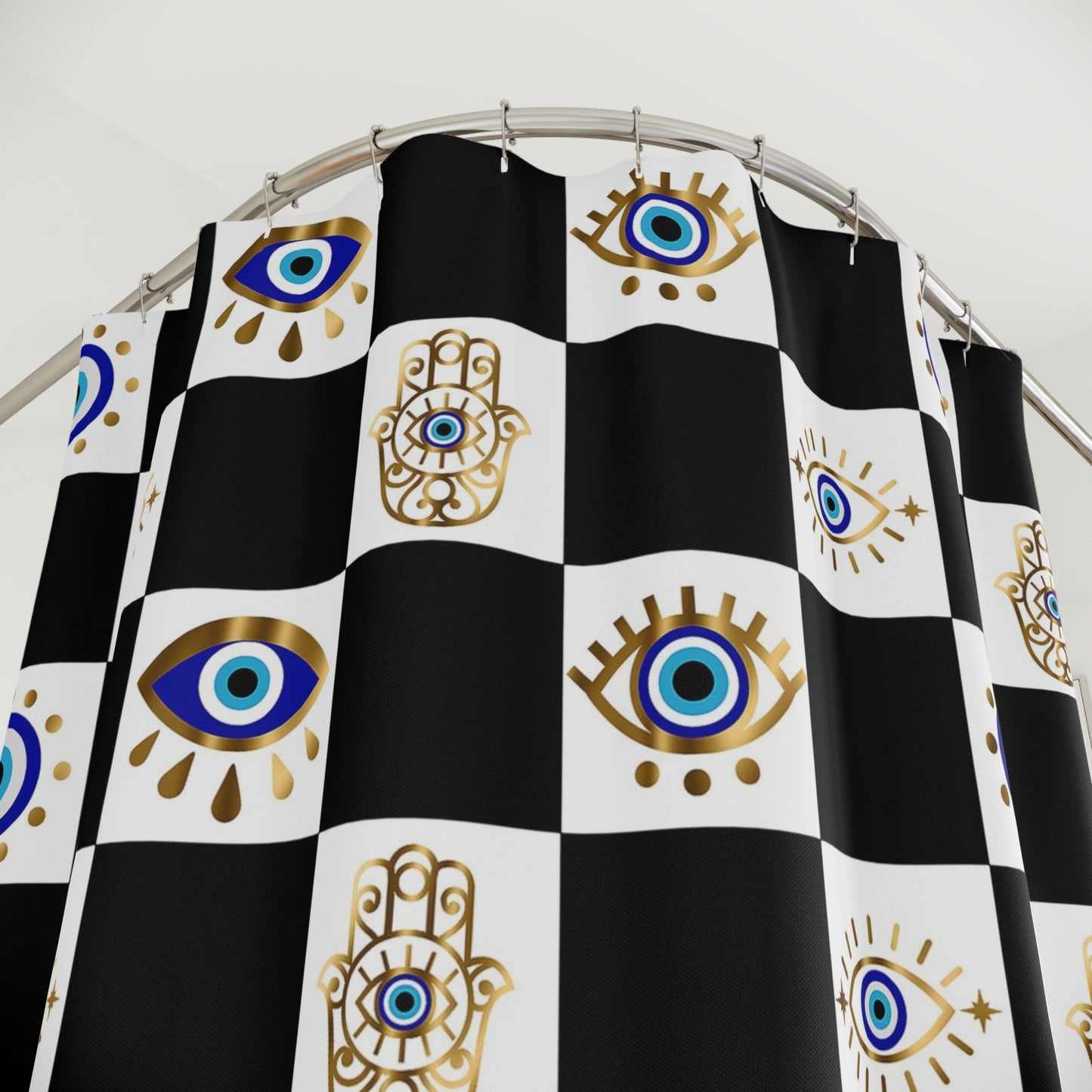 Shower curtain with black and white checkered pattern and eye and hamsa hand designs.