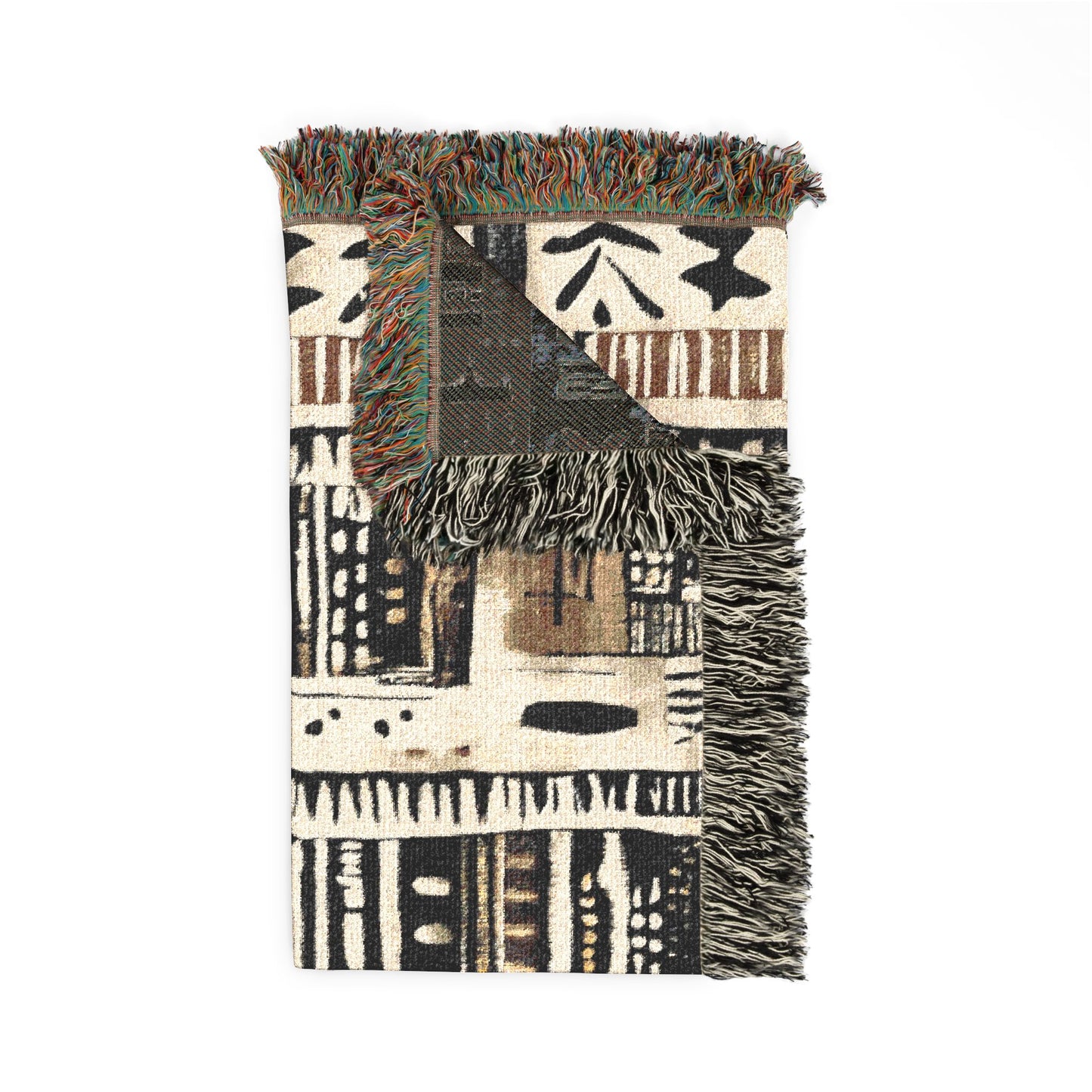 Patterned throw blanket with fringes on a white background