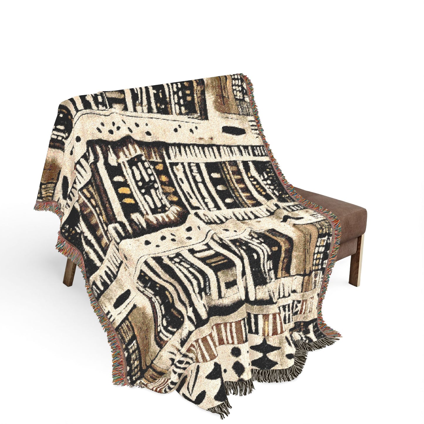 Patterned blanket draped over a chair on a white background