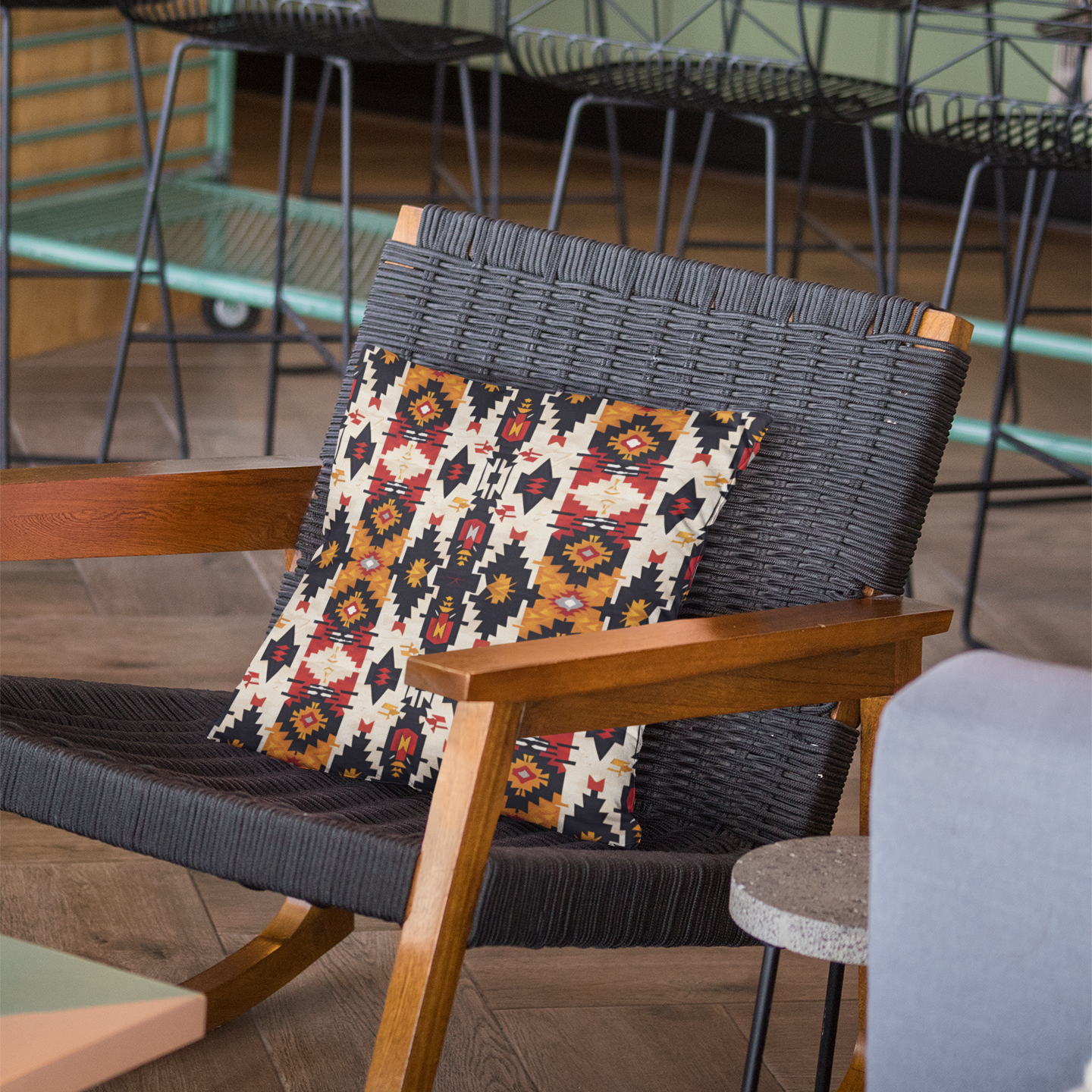 Wicker chair with a patterned pillow in an indoor setting