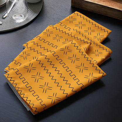 Cultural dining linens including African print napkins, placemats, and table runners.